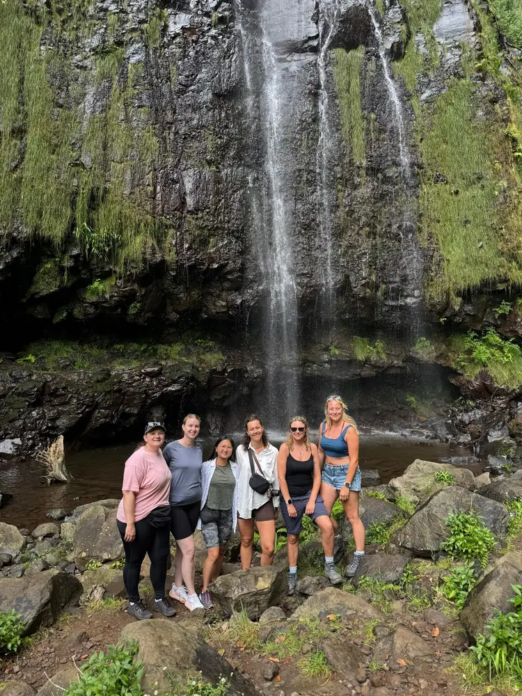Emerald Forest group under waterfall