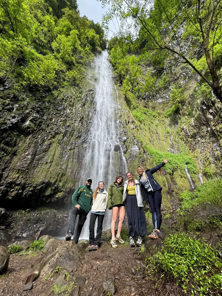 Emerald Forest guests at a waterfall