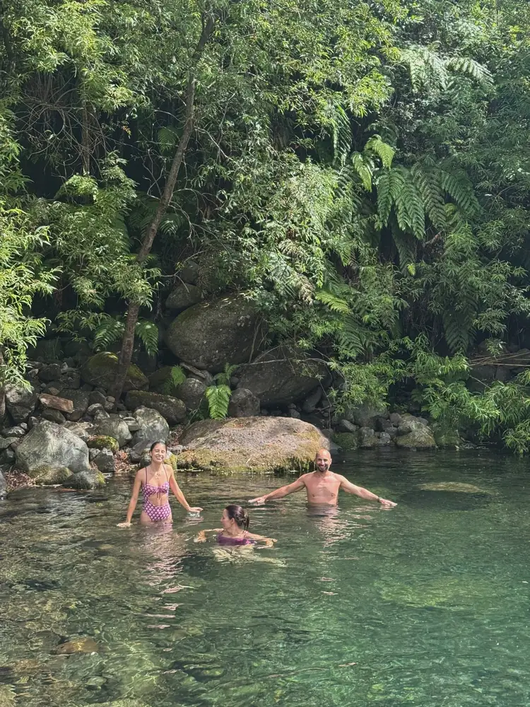 Emerald Forest guests swimming in clear water