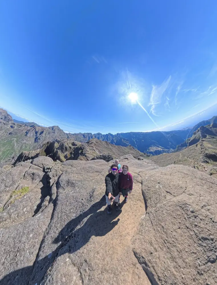 Pico Grande hikers on sunlit rocks