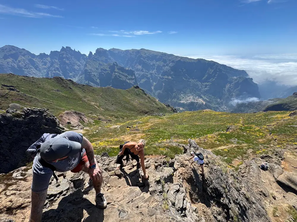 Pico Grande hikers climbing rocky mountain trail