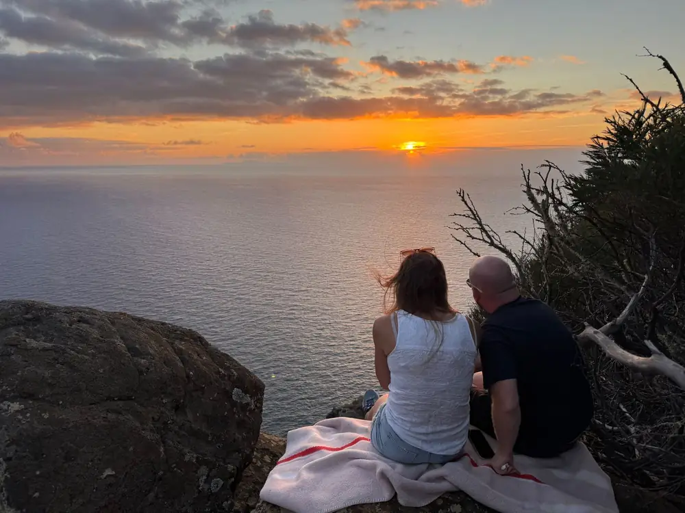 Private Sunrise couple watching the sun over the Atlantic